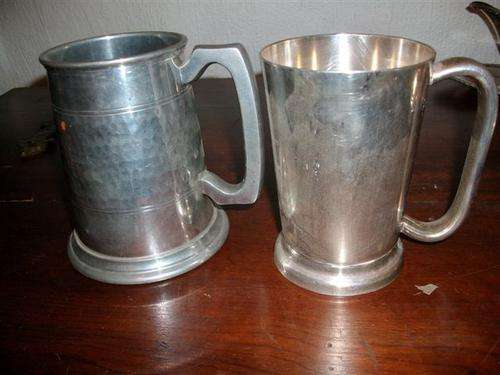 Some sliver plate beer mugs one is pewter